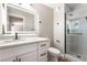Modern bathroom features white cabinets, quartz counters, and glass shower at 2749 Del Mar Pl, Las Vegas, NV 89169