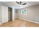 Cozy bedroom with hardwood floors, open closet, and bright window at 2749 Del Mar Pl, Las Vegas, NV 89169