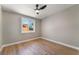 Comfortable bedroom with hardwood floors, large window with backyard view at 2749 Del Mar Pl, Las Vegas, NV 89169