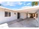 Inviting front entrance with a covered carport, security door, and well-maintained exterior finishes at 2749 Del Mar Pl, Las Vegas, NV 89169