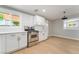 Bright kitchen with white cabinets, stainless steel oven, and light wood flooring at 2749 Del Mar Pl, Las Vegas, NV 89169