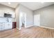 This combination kitchen/living area has wood-look floors and modern finishes at 2749 Del Mar Pl, Las Vegas, NV 89169
