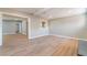 Open living room with light wood floors and access to other rooms in the house at 2749 Del Mar Pl, Las Vegas, NV 89169