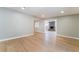 Bright and airy living room with hardwood floors and a view of the fireplace in the next room at 2749 Del Mar Pl, Las Vegas, NV 89169