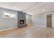Bright living room with modern tiled fireplace provides a warm and stylish ambiance at 2749 Del Mar Pl, Las Vegas, NV 89169