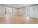 Inviting living room featuring new hardwood floors, fresh paint, and a bright front door at 2749 Del Mar Pl, Las Vegas, NV 89169