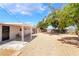 Covered patio area with desert landscaping and privacy fence providing an ideal outdoor space at 2749 Del Mar Pl, Las Vegas, NV 89169