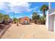 Charming shed with desert landscaping and a walkway, adding character and functionality to the yard at 2749 Del Mar Pl, Las Vegas, NV 89169