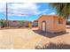 Close up view of the shed with desert landscaping and charming design, providing extra storage space at 2749 Del Mar Pl, Las Vegas, NV 89169