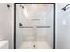 This shower features glass doors, subway tile, and sleek black hardware at 2749 Del Mar Pl, Las Vegas, NV 89169