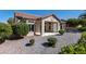 Well-maintained backyard area with low maintenance landscaping and covered patio at 2755 Darby Falls Dr, Las Vegas, NV 89134