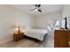 Cozy bedroom featuring a ceiling fan and window providing ample natural light at 2755 Darby Falls Dr, Las Vegas, NV 89134