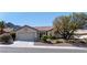 Charming single-story home featuring a well-manicured front yard and attached two-car garage at 2755 Darby Falls Dr, Las Vegas, NV 89134