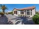 Charming desert home with well-manicured landscaping and a tile roof at 2755 Darby Falls Dr, Las Vegas, NV 89134