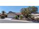 Charming single-story home featuring a well-manicured front yard and attached two-car garage at 2755 Darby Falls Dr, Las Vegas, NV 89134