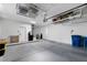 Spacious garage with overhead storage racks and epoxy flooring at 2755 Darby Falls Dr, Las Vegas, NV 89134