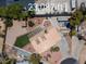 Drone shot of a large backyard featuring desert landscaping and artifical grass at 2821 Moon Cir, Las Vegas, NV 89120