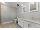 Bright bathroom with double sinks, granite countertops, and walk-in shower at 2821 Moon Cir, Las Vegas, NV 89120