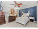 This bedroom offers a cozy ambiance with its ceiling fan, and elegant furnishings for a comfortable personal space at 2821 Moon Cir, Las Vegas, NV 89120