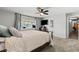 Comfortable bedroom with ceiling fan, carpet and large windows at 2821 Moon Cir, Las Vegas, NV 89120