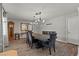 Charming dining room featuring wood floors, chandelier and formal furniture at 2821 Moon Cir, Las Vegas, NV 89120