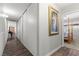 Inviting hallway with hardwood floors leading to the bedroom at 2821 Moon Cir, Las Vegas, NV 89120