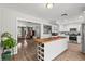 Bright, updated kitchen with stainless appliances, island, and access to living area at 2821 Moon Cir, Las Vegas, NV 89120