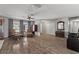 Open living room boasts wood flooring, natural light, and classic furniture at 2821 Moon Cir, Las Vegas, NV 89120