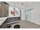 Spacious bathroom with double vanities, modern lighting, walk-in shower and a separate toilet room at 324 Park Way East, Las Vegas, NV 89106