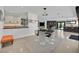 Open-concept dining area with a modern table set, connecting the kitchen, bar, and living room at 324 Park Way East, Las Vegas, NV 89106
