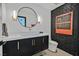 Modern bathroom showcasing a vessel sink, unique mirror, and textured wall accent at 324 Park Way, Las Vegas, NV 89106