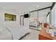 Well-lit bedroom with a modern dresser, bedside tables, and a sleek, comfortable bed at 324 Park Way, Las Vegas, NV 89106