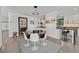 Open dining area features a modern round table, sleek chairs and contemporary lighting at 324 Park Way, Las Vegas, NV 89106