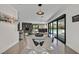 Bright dining space offering access to the fireplace, outdoor pool, and well-appointed bar at 324 Park Way, Las Vegas, NV 89106