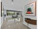 Bright and airy foyer showcasing elegant decor, polished concrete floors, and expansive windows at 324 Park Way, Las Vegas, NV 89106