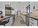 Gourmet kitchen featuring modern appliances, sleek black countertops, and ample cabinetry at 324 Park Way, Las Vegas, NV 89106
