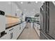 Galley kitchen boasting custom cabinets, sleek countertops, and stainless steel appliances at 324 Park Way, Las Vegas, NV 89106