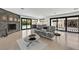 Elegant living room boasts fireplace, modern furnishings and seamless access to the pool area at 324 Park Way, Las Vegas, NV 89106