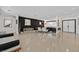 Spacious living room featuring polished concrete floors, modern decor, and ample natural light at 324 Park Way, Las Vegas, NV 89106