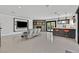 Well-lit living room featuring fireplace, bar area, and seamless access to the outdoor pool at 324 Park Way, Las Vegas, NV 89106