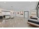 Expansive living room with polished concrete floors, sleek furniture, and abundant natural light at 324 Park Way, Las Vegas, NV 89106