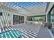 Covered outdoor patio featuring a spa, modern furniture, and plenty of natural light at 324 Park Way, Las Vegas, NV 89106