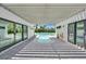 Stunning outdoor pool with a long spa, covered patio and beautiful landscaping at 324 Park Way, Las Vegas, NV 89106