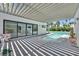 Beautiful outdoor pool area with covered patio and seating, ideal for relaxation at 324 Park Way, Las Vegas, NV 89106