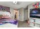 Cozy bedroom featuring gray walls, carpet, ceiling fan, closet and a standard size bed at 327 Fuente Dr, Henderson, NV 89014