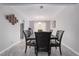 Elegant dining room featuring a stylish table with seating for six, complemented by tile flooring and modern decor at 327 Fuente Dr, Henderson, NV 89014