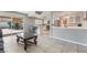 View of the living room featuring an open layout to the kitchen and access to the backyard at 327 Fuente Dr, Henderson, NV 89014