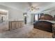 Spacious main bedroom featuring a ceiling fan, carpet, and a huge walk-in closet at 327 Fuente Dr, Henderson, NV 89014
