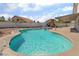 Refreshing swimming pool with a play area, surrounded by a spacious patio and lush landscaping for outdoor fun at 327 Fuente Dr, Henderson, NV 89014
