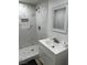 Updated bathroom showcasing marble tile shower, sleek vanity, and modern finishes for a clean look at 335 W Basic Rd, Henderson, NV 89015